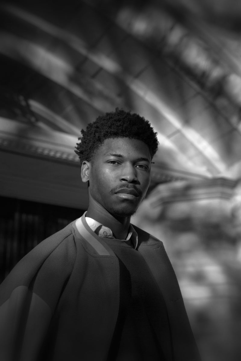 Black and white portrait of a person with a blurred background